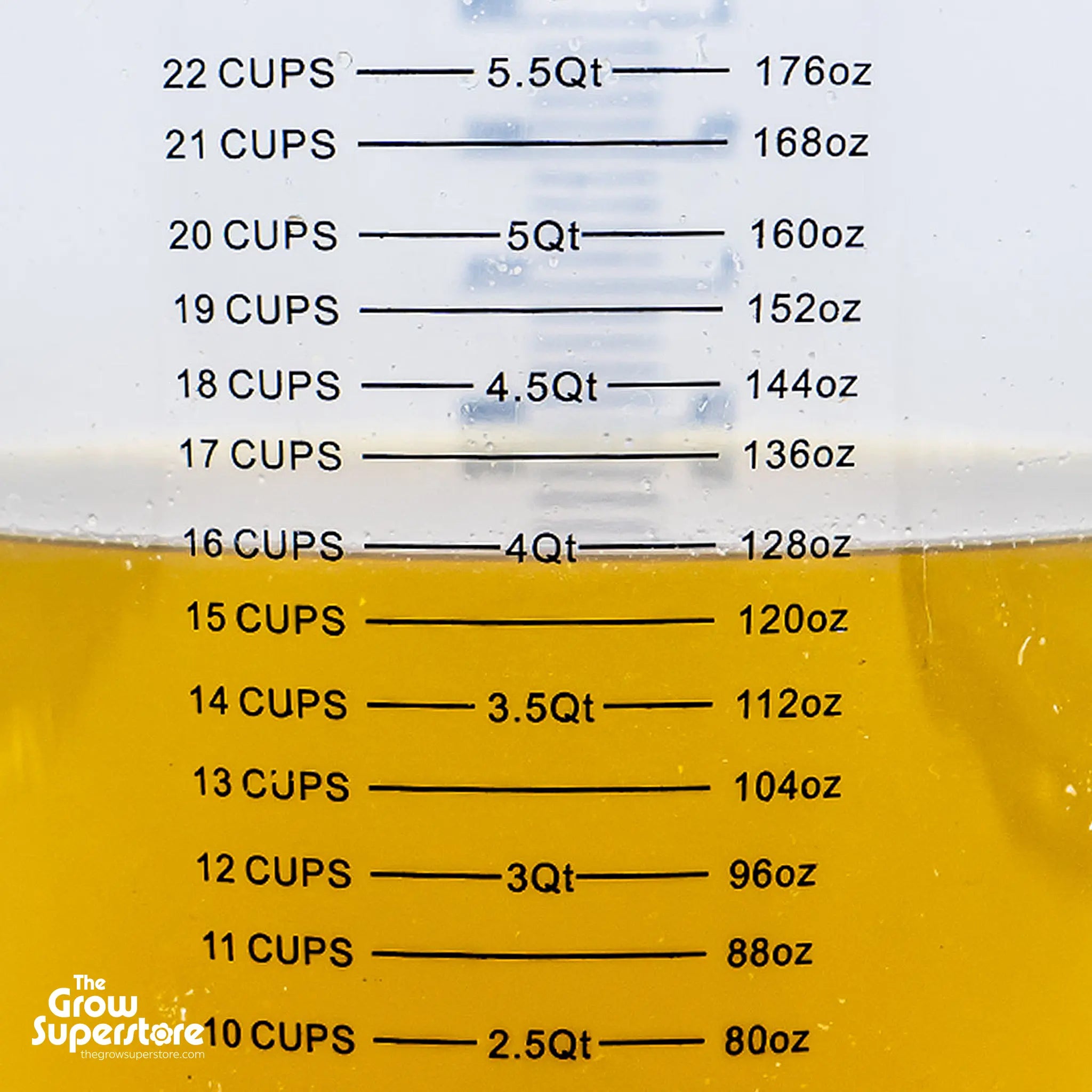 Jug with measurement markings in cups and ounces filled with nutrient mix – thegrowsuperstore.com