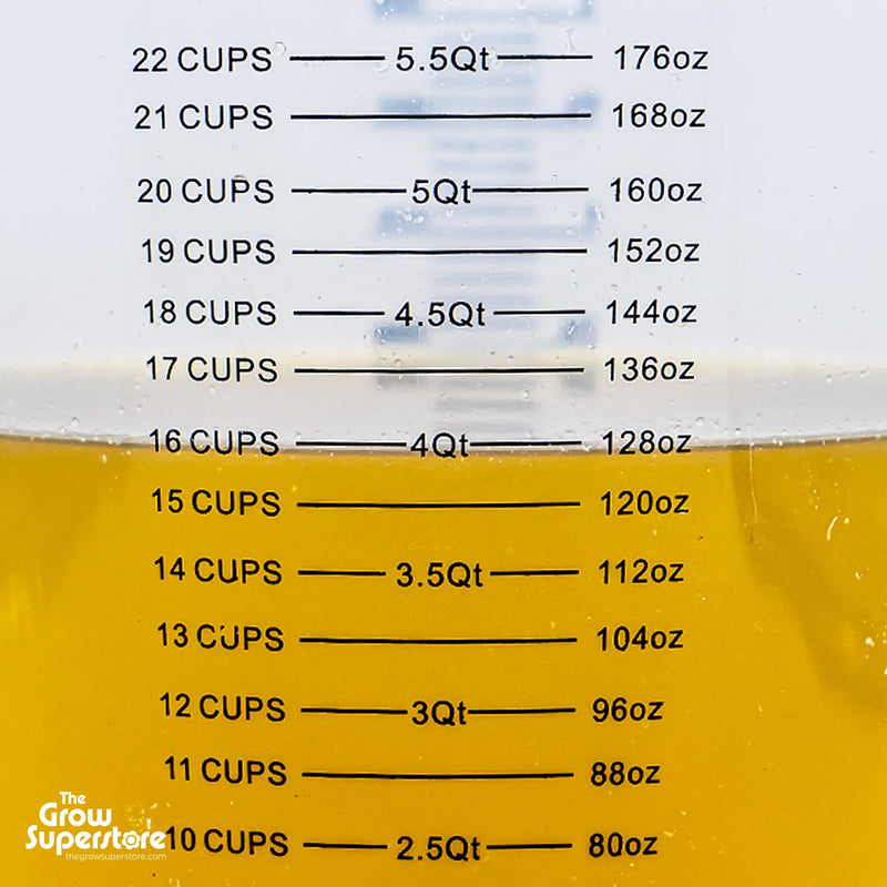 Jug with measurement markings in cups and ounces filled with nutrient mix – thegrowsuperstore.com