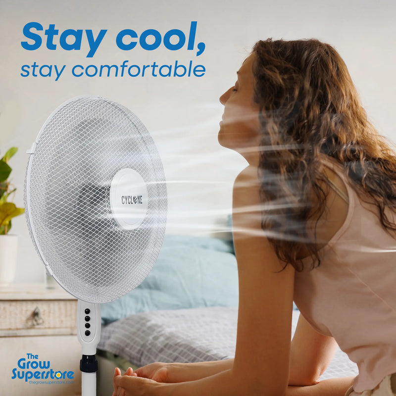 Cyclone 16‑inch pedestal fan in bedroom setting providing gentle airflow to seated person – thegrowsuperstore.com
